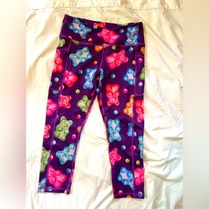 Purple leggings with gummy bears print! Shin length with pockets size medium